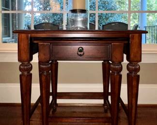 Pair of nesting tables; candle holder with candle