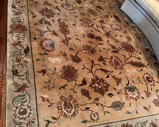 Machine made wool area rug