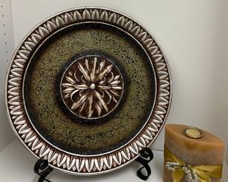 Silver charger; candle