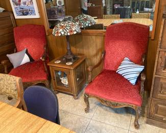 Two antique red matching chairs