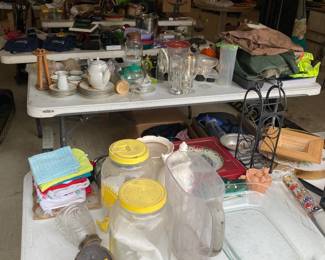 Four tables of household items including shoes, caps, backpacks and luggage