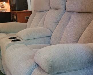 Reclining love seat with center cup holders that fold up