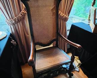 Antique carved cane back chair.