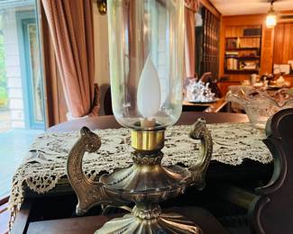 A fine pair of antique lamps with hurricane shades. 