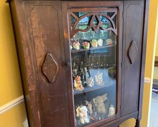 Vintage curio cabinet.  Needs just a tiny amount of TLC, and filled with all kinds of treasures too