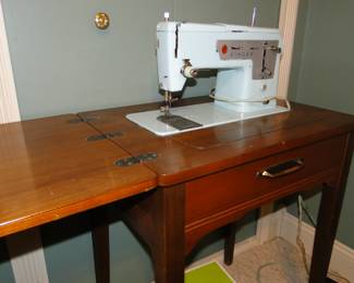 Singer sewing machine, with cabinet.