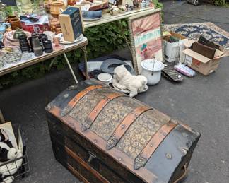 Gorgeous hump back trunk, art, small area rug, box of black and white photos, binoculars, chamber pot w lid, cast iron, granite bed pan, Abingdon pottery, watt pottery