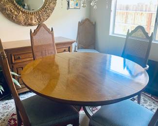 Thomasville - 48" Pecan wood dining table with white base, (2) 12 inch leaf, protection pads and 6 cane back upholstered chairs - 1 arm chair