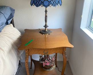 Antique Oak table with under shelf   ---  Tiffany style lamp ---  brass head/foot board double bed with mattress and duvet/dust ruffle/shams