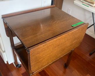 Antique Oak drop leaf table on wheels with under shelf