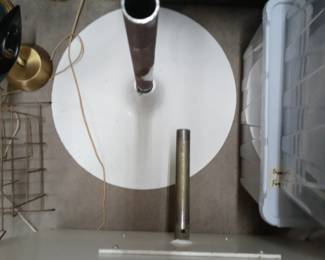 2 piece MCM table top rotates and is square. This picture features the rounded base