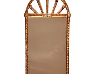 ORNATE WOOD CARVED MIRROR | late 19th/ early 20th century, wooden framed mirror with spiraled column sides and a spoked arch top, egg and dart border, mounted with acanthus leaves and rosettes. - l. 48.5 x h. 52 in