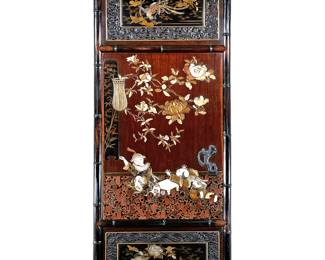 CARVED AND LACQUERED APPLIQUÉ PANEL | late 19th/ early 20th century, Intricately carved and lacquered panel showing figures in an interior scene, plus views of a rooster and blossoming plants. - w. 23.5 x h. 56 in