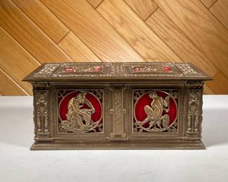 BRASS GRECO ROMAN STYLE COFFER | Brass coffer with Greco Roman style scenes in square relief on top and front, interior padded red velvet with mount on lid, possibly a humidor. - l. 11.25 x w. 6.5 x h. 4.75 in