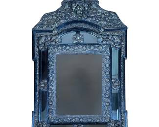ORNATE BEVELED MIRROR WITH INTRICATE BRASS RELIEF | Beveled mirror with ornate stamped brass relief depicting flora and fauna with baby relief crown. - l. 26.5 x w. 3 x h. 44 in