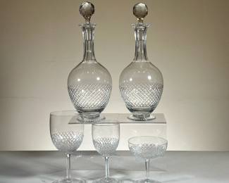 (26PC) VAL ST LAMBERT CUT CRYSTAL SET | Including; 9 wine glasses (H. 6.75 in. Dia. 3 in.), 9 water glasses (H. 5.75 in. Dia. 2.5 in.), 6 champagne glasses (H. 4 in. Dia. 3.75 in.), and 2 decanters with cut crystal stopper. - h. 12.5 x dia. 4.5 in