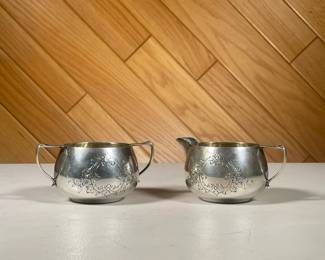 STERLING CREAMER & SUGAR BOWL | With pressed engraved decoration, stamped on bottom "Sterling / 464"; Total weight 9 ozt. - h. 2.25 x dia. 3.5 in