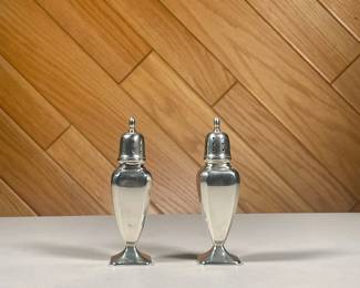 (2PC) STERLING SALT & PEPPER SHAKERS | Marked on bottom with hallmarks "Sterling / 844"; Total weight 4 ozt. - w. 1.25 x h. 5 in
