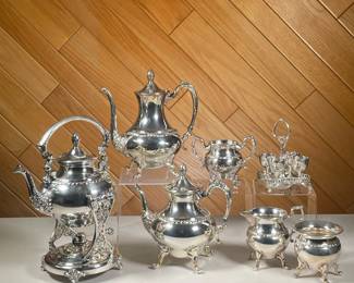 (7PC) SILVER PLATE TEA & COFFEE SET | Silver plate on copper tea set including; Hot water kettle with oil heater and stand, coffee and tea pot, sugar bowl, creamer, and set of Victorian Plate egg cups with platter. - h. 13 x dia. 6.5 in (hot water kettle w/ stand)