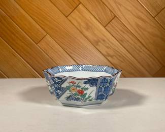 TIFFANY & CO. PAINTED BOWL | Octagonal bowl showing 4 floral scenes divided by blue and white cross-hatched and hexagonal patterns. - l. 6 x w. 6 x h. 2.5 in