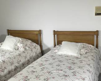 (2PC) PAIR WOODEN TWIN BED FRAMES | Two twin wooden bed frame; probably National Furniture. - l. 78.5 x w. 41 x h. 38.5 in