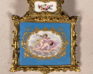 ANTIQUE BRASS CARD WRITING TRAY | More research into this needed Showing small painted scene of 2 cupids with gilt border and flip-top inkwell with ceramic panel lid. - l. 6.5 x w. 5.5 x h. 1.5 in
