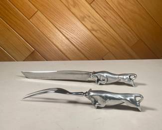 (2PC) BULL CARVING SET | The Wilton Company carving set made in Solingen Germany, includes carving knife and carving fork with charging bull handle. - l. 13.5 x h. 1.5 in