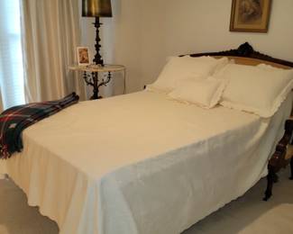 Custom antique settee made into a bedrame