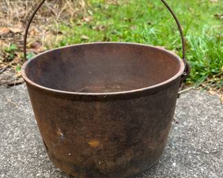 Cast iron, about 9” diameter 