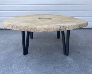coffee table make with repurposed oxcart wheel