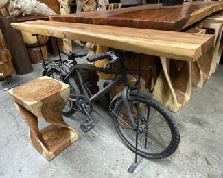 wood slab console incorporating a real bike