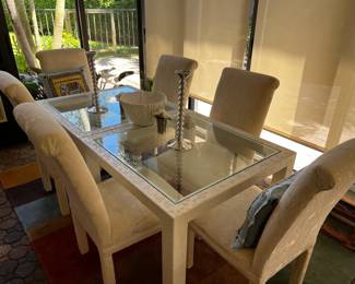 Dining room table and 6 upholstered chairs.  Table can be separated into two square tables they can be game tables