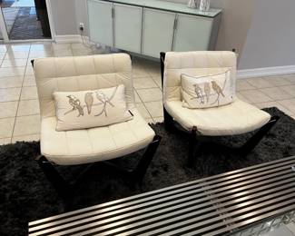 two white leather barcelona chairs can be in living room or bedroom