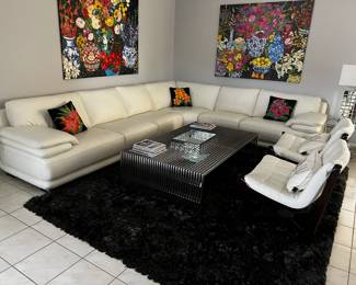 white leather sectional couch and rug