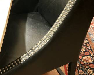 One of two leather bar stools