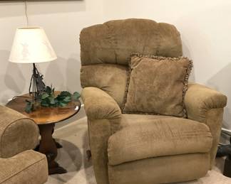 One of two matching recliners; small round side table