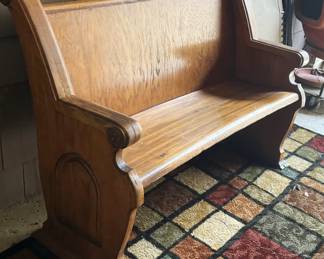 Antique bench; colorful rug