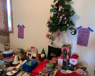 Come peruse the fun Christmas tables marked .50 and $1!