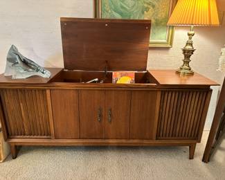 Mid century record player with built in speakers, some vinyl