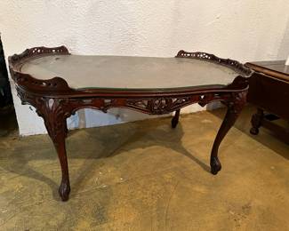 Oval glass top ornate coffee table