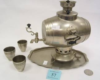 MINIATURE SAMOVAR 1976-1980 OLYMPICS SOUVENIR TRAY AND THREE VODKA CUPS. HAS MATCHING TRAY. DENTS ON EITHER SIDE UNDER HANDLES.