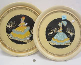 Pair of silhouette style round paintings 