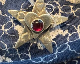Sterling garnet signed star pin
