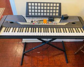 $150  Yamaha portatone GX76 piano on stand 
