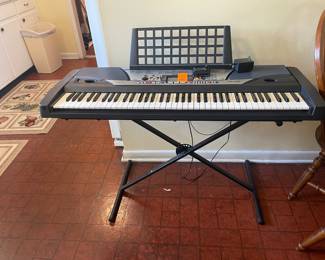 $150  Yamaha portatone GX76 piano on stand