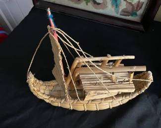 Vintage folk art straw boat.