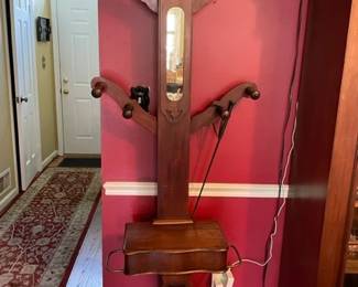 Victorian coat rack with four articulated arms.