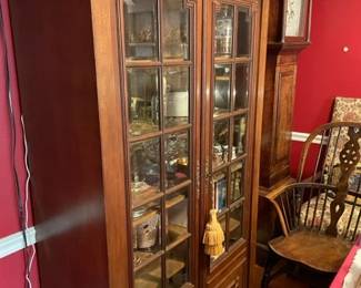 Antique wood and glass display cabinet.