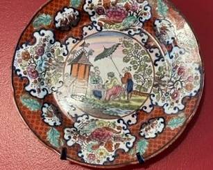Early 19th-century hand-painted cabinet plate.