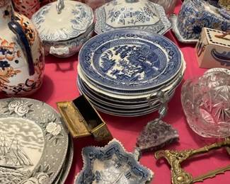 Assorted blue and white and brown and white dishes.